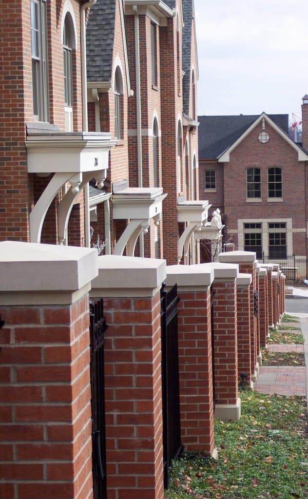 Midwest Cast Stone Brick Fence with Cast Stone accents