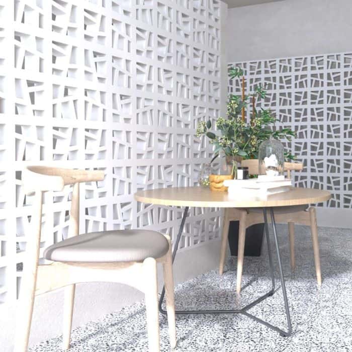 Table and Chair with Villa Lagon Tile Breeze Blocks Behind